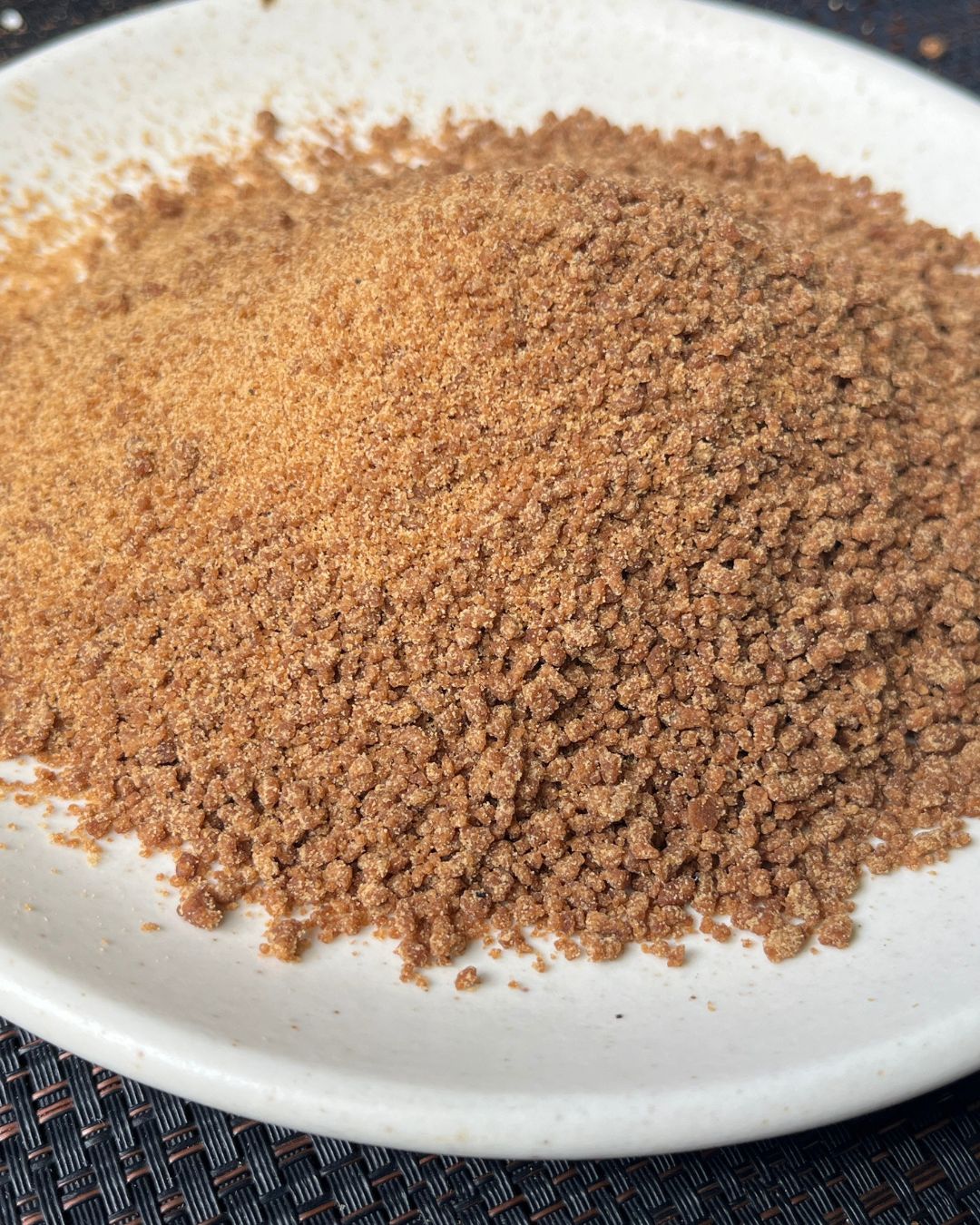 OrganicBandhu khandsari sugar on a white plate